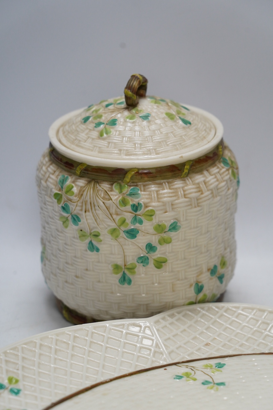 A Belleek cabaret tray and biscuit barrel with cover, clover decoration, 45cm. Condition - cover repaired